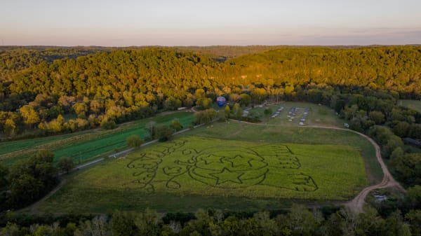 Aerial view of the farm and corn maze at golden hour