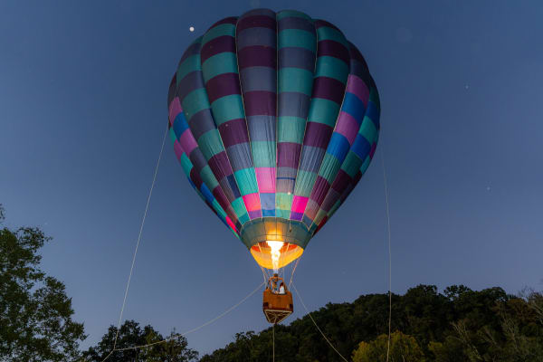 Hot air balloon glowing at dusk