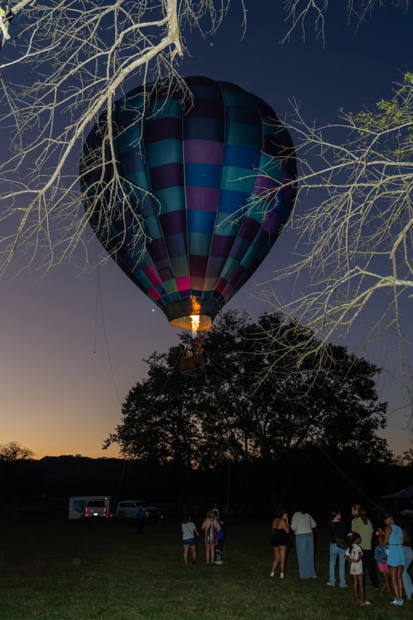 Hot air balloon glowing at dusk