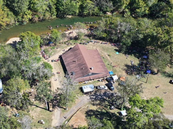 Aerial view of the barn beside the river