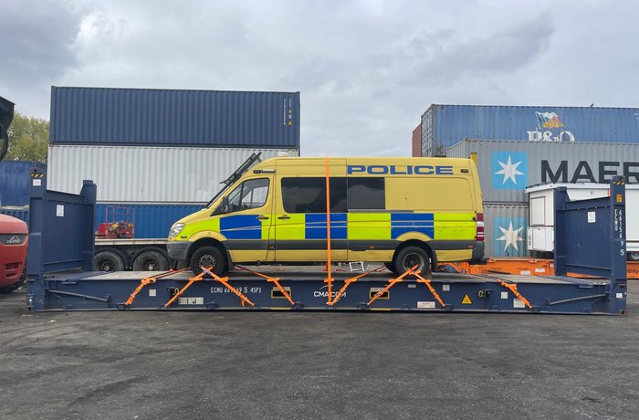 Police Vans on flat racks