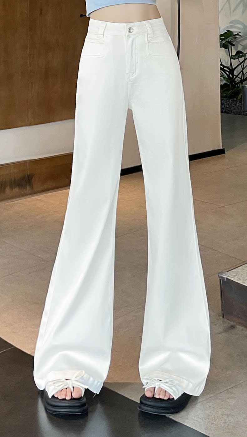 YEEYEEWang Flare Jeans, Asian-fit cut, clean full front view with high-rise waist, smooth fly front and fluid full-length drape.