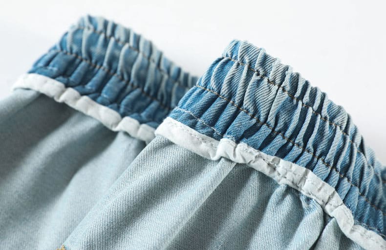 YEEYEEWang wide-leg jeans, Asian-fit cut, close-up of unlined elastic waistband interior with even shirring and bound seams.