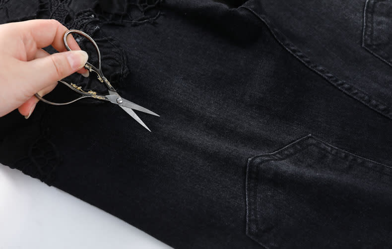 YEEYEEWang Wide-Leg Jeans, Asian-fit cut, close-up of dense denim twill beside the lace panel, showing tight weave and structured texture.