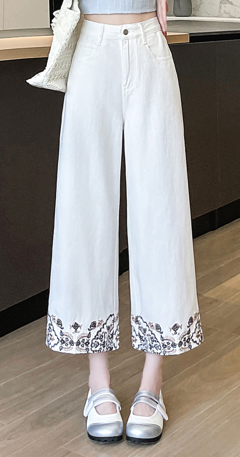 YEEYEEWang Wide-Leg Jeans in Ivory, Asian-fit cut, front full outfit view with floral embroidered hem, silver-tone button and woven tote styling.