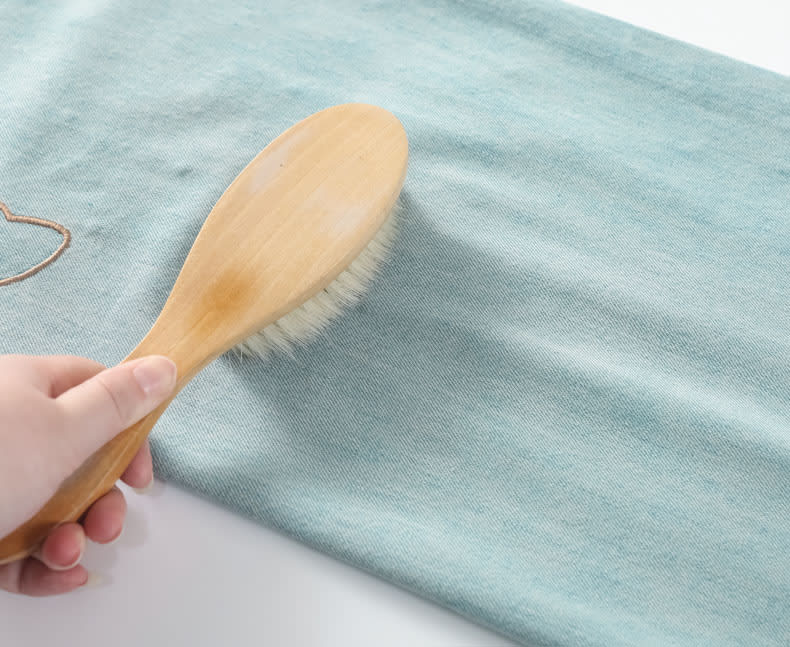 YEEYEEWang Wide-Leg Jeans, Asian-fit cut, close-up of smooth denim surface shown with a soft wooden brush on the fabric.