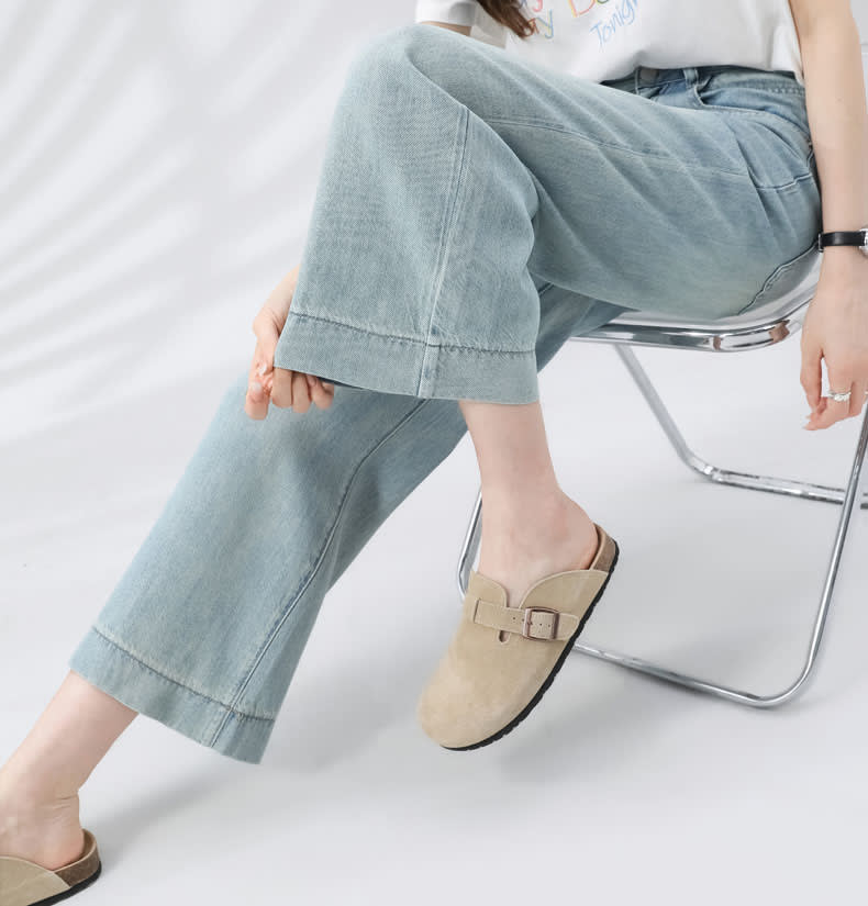 YEEYEEWang Wide-Leg Jeans, Asian-fit cut, seated pose showing relaxed wide leg and wide stitched hem styled with buckle mules.