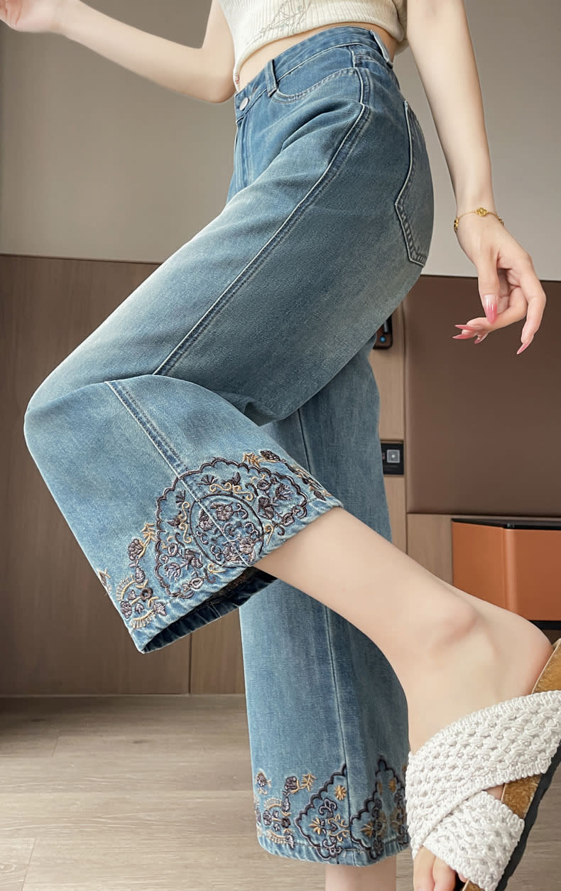 YEEYEEWang Straight-Leg Jeans, Asian-fit cut, side view with lifted leg showing floral embroidery at hem, smooth hip fit.