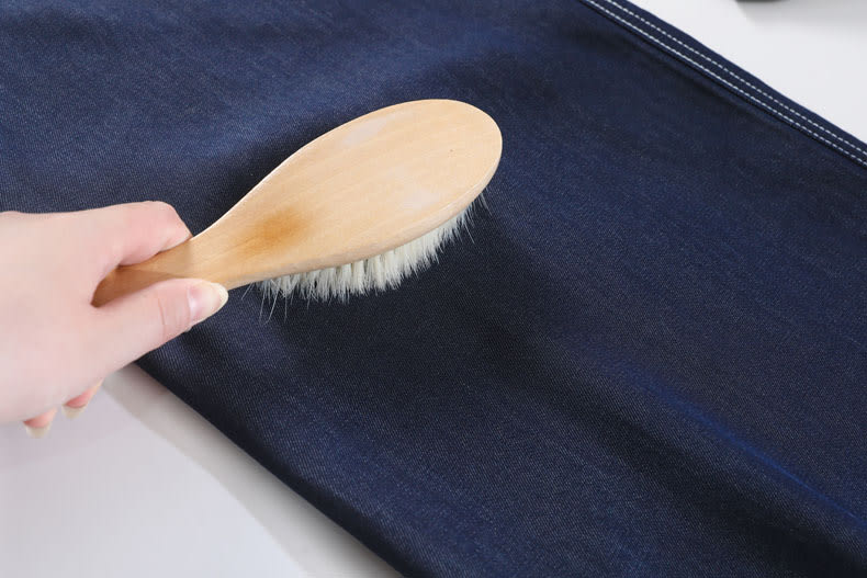 YEEYEEWang Wide-Leg Jeans in Denim Blue, Asian-fit cut, close view of smooth even fabric surface with dense fine weave.