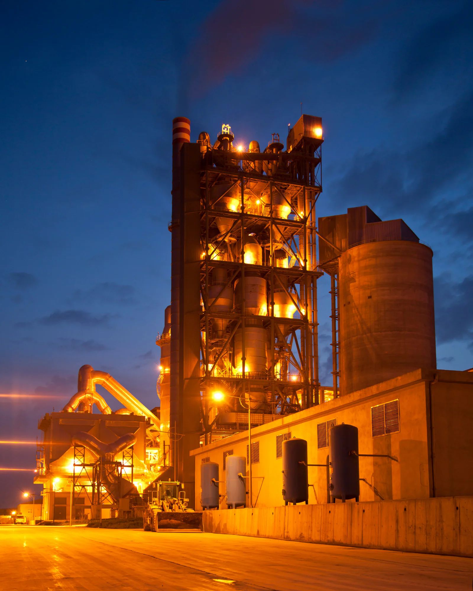 Cement plant tanks, kiln and preheater on the running line