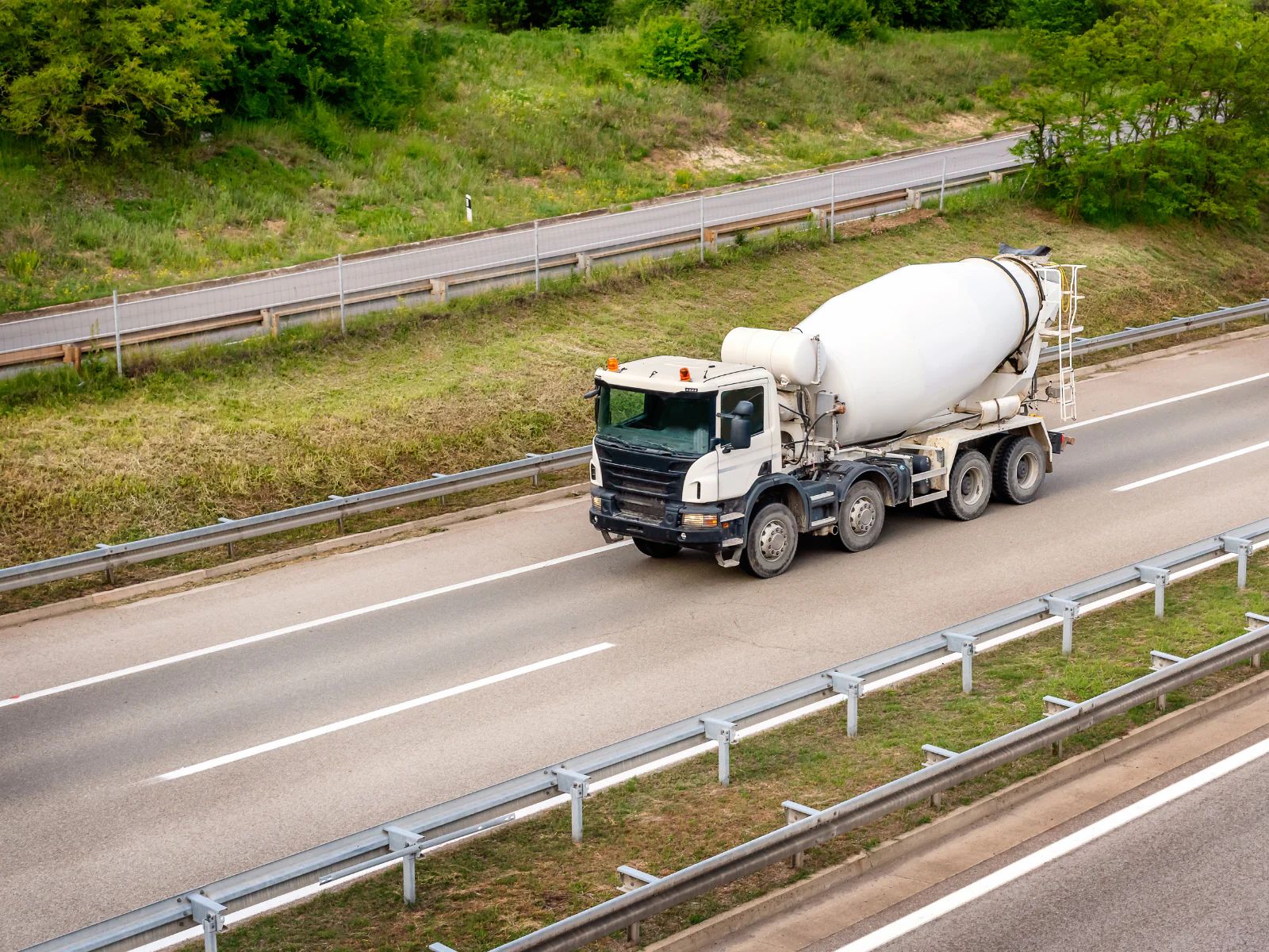 Ready-mix concrete dispatcher reviewing truck routes and delivery schedules