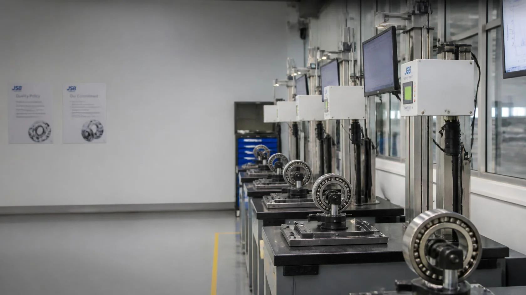 Bearing vibration test station with cross-station measurement consistency analytics