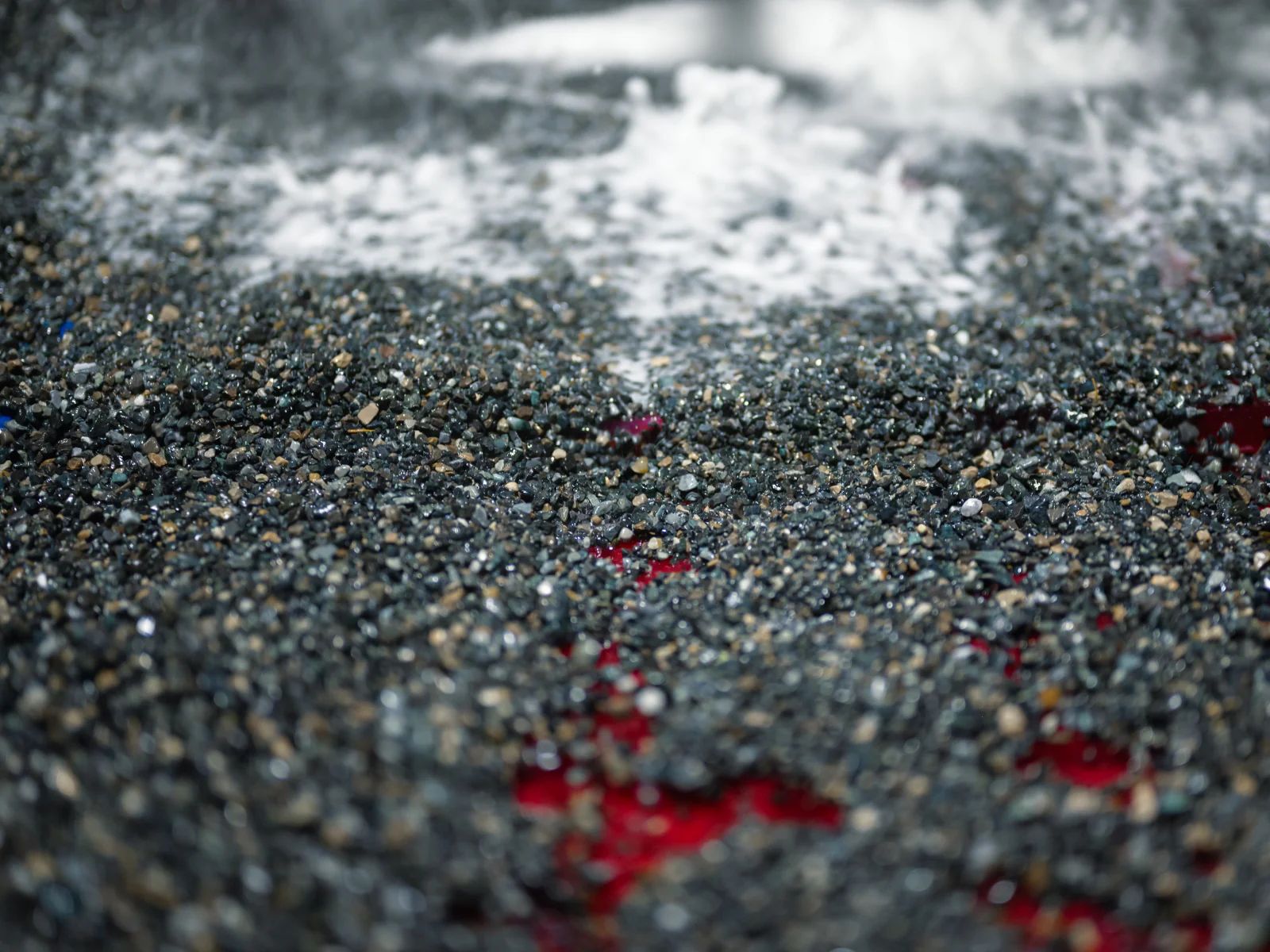 Metallurgist reviewing recovery and concentrate grade trends against feed variability