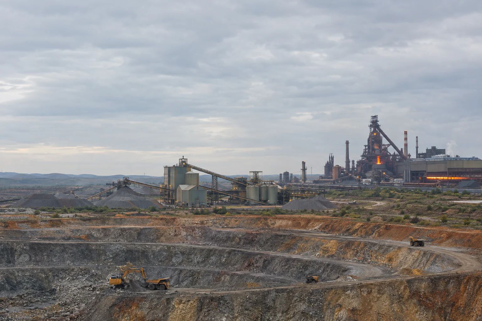 Heavy industrial operations spanning mining, processing, and metals plants