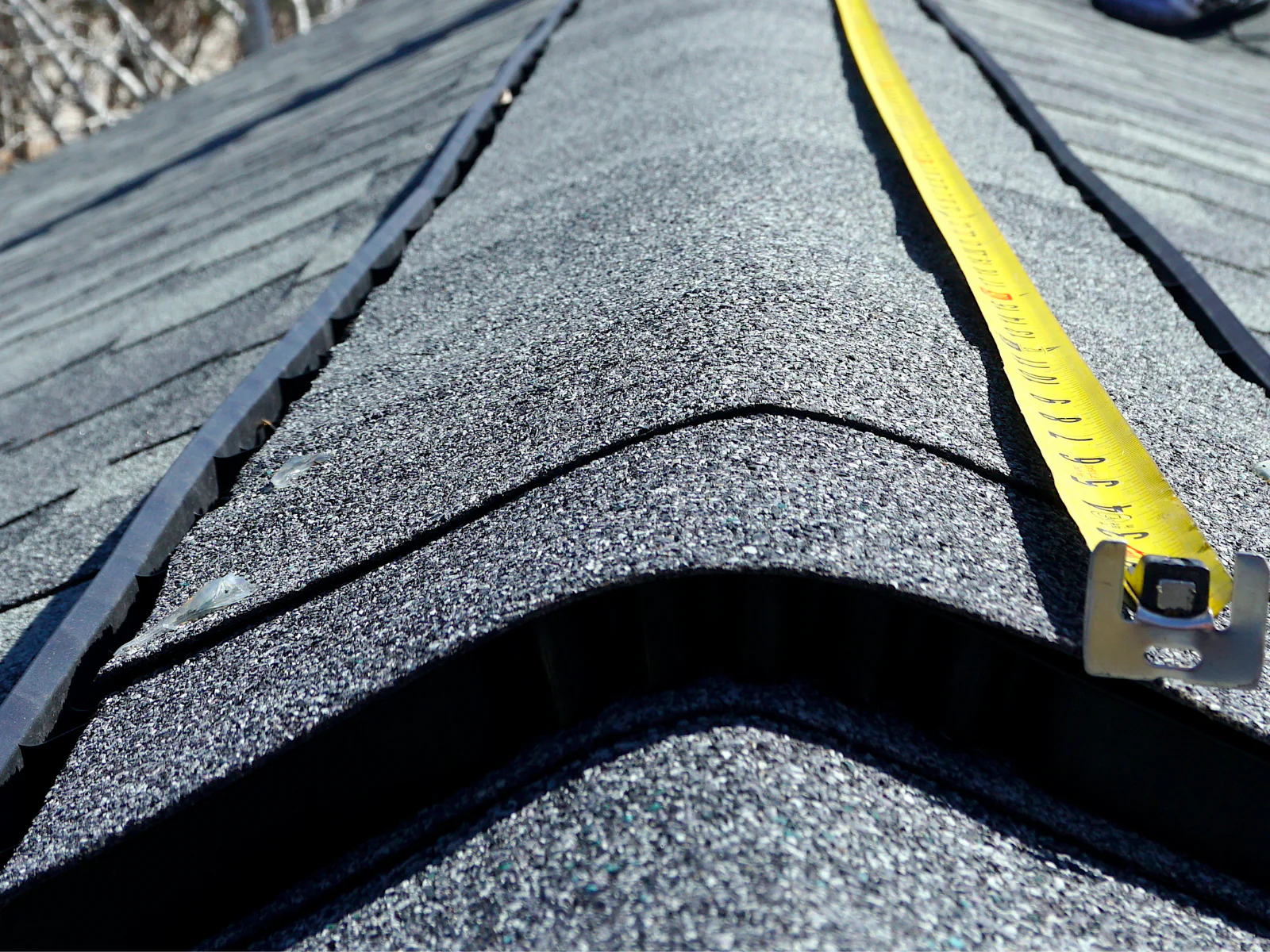Roof and building site where measurements still have to be taken by hand before a quote can go out