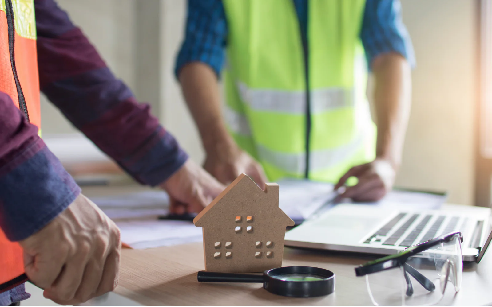 Roofing professional reviewing measurements and project plans