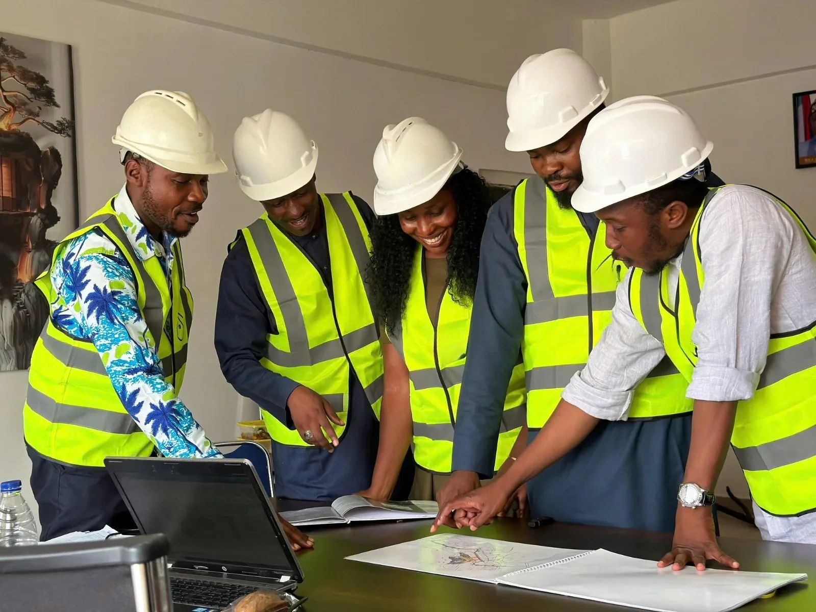 Estimating team reviewing a draft roof quotation