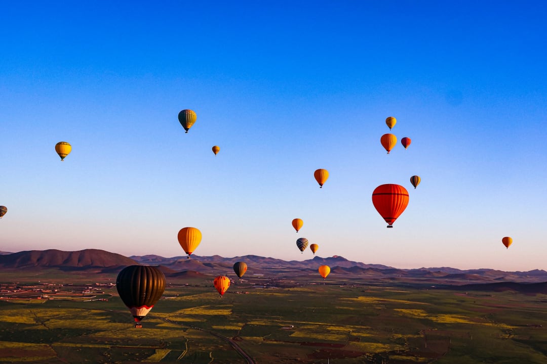 Hot air balloons at sunrise near Marrakech