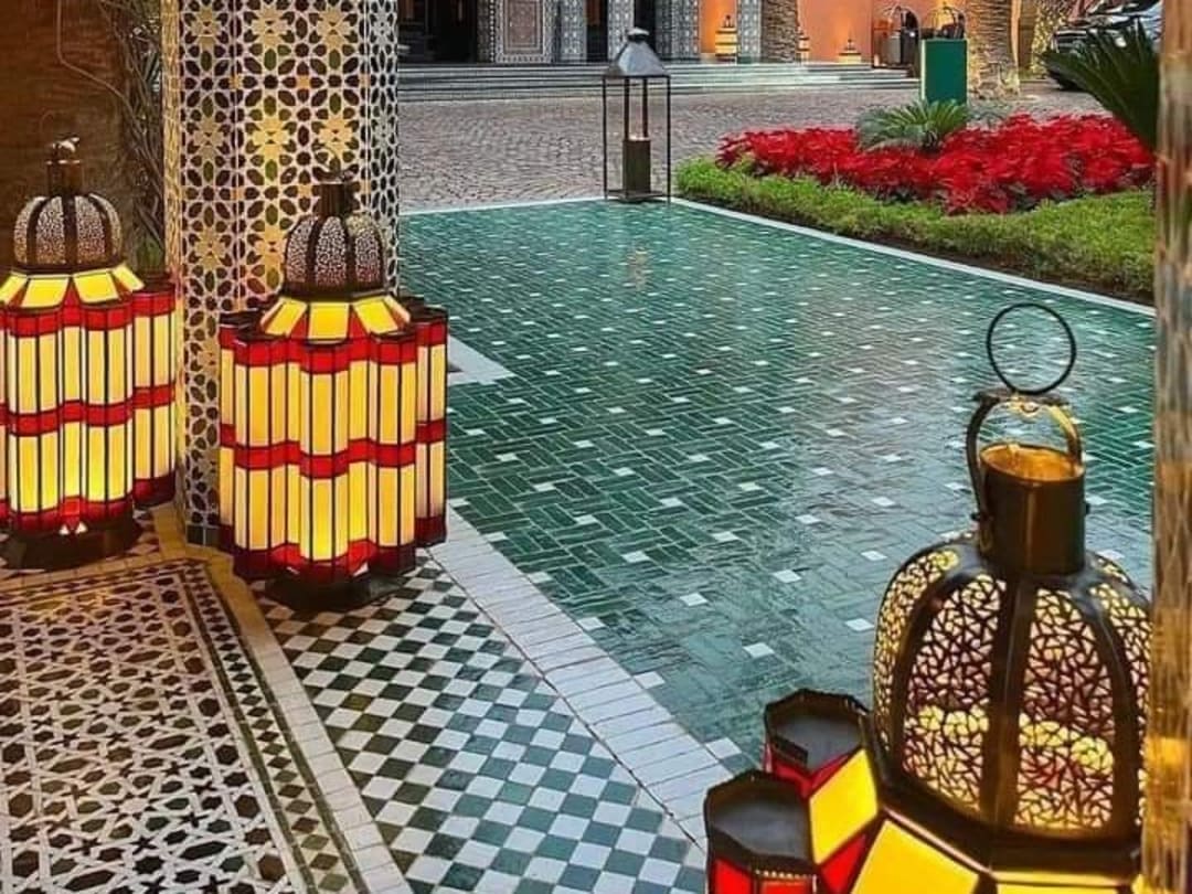 Riad patio with lanterns and zellige in Marrakech