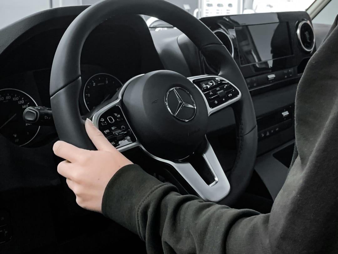 Driver at the wheel of a Mercedes vehicle