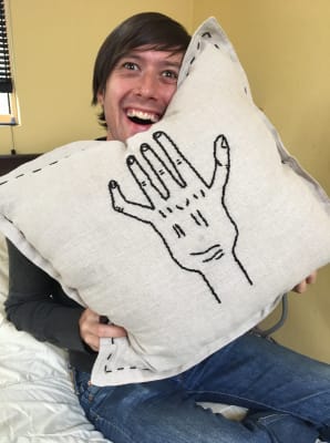 laughing with pillow
