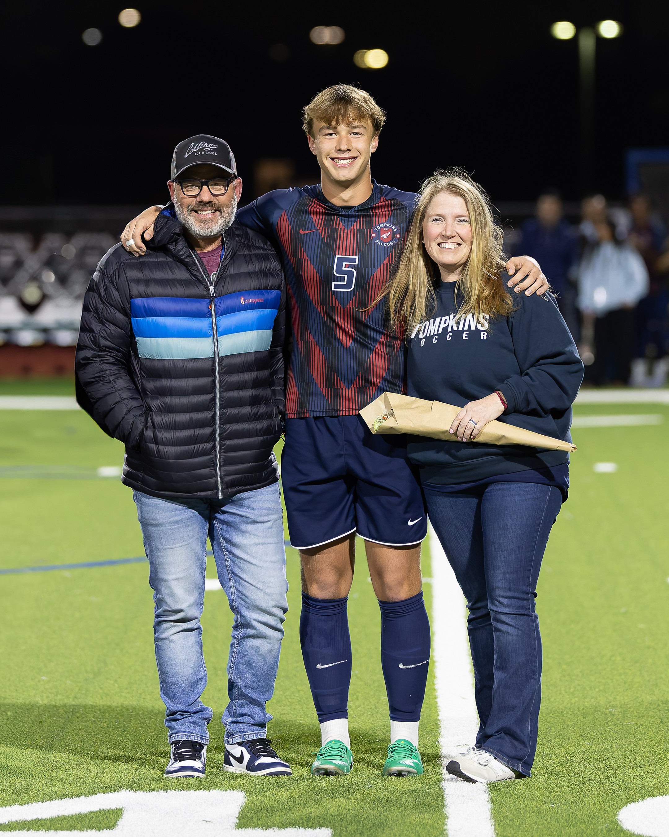 Matt Powell with family on the field