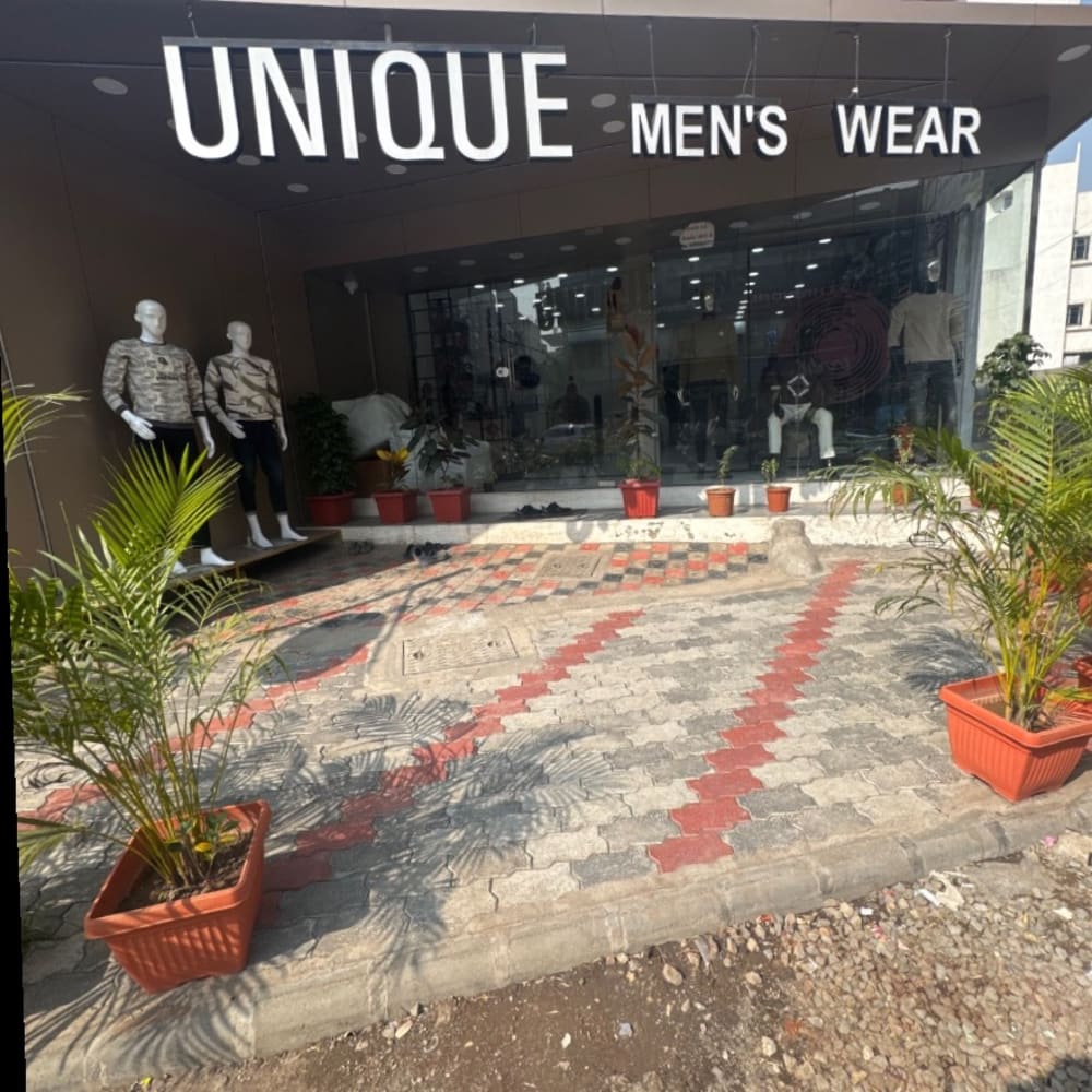UNIQUE MENS WEAR  logo