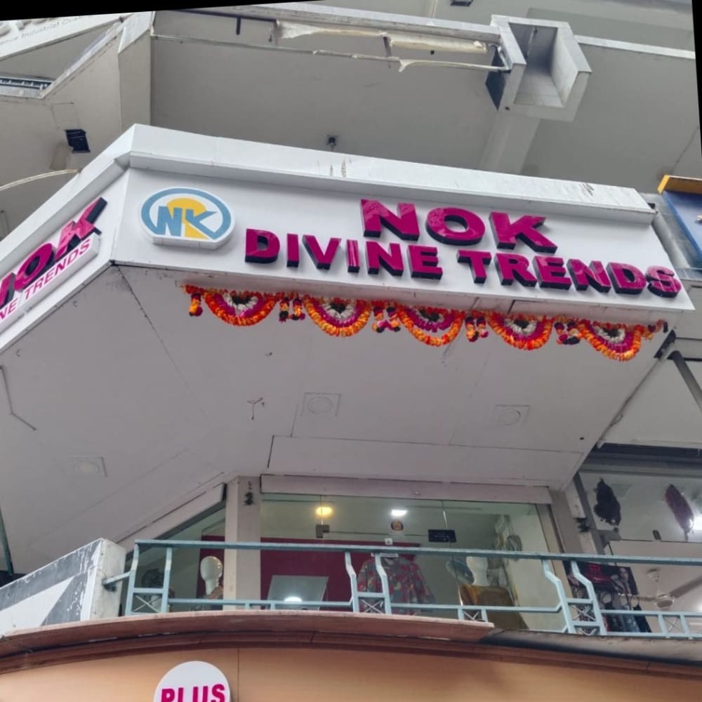 Nok Divine trends  logo