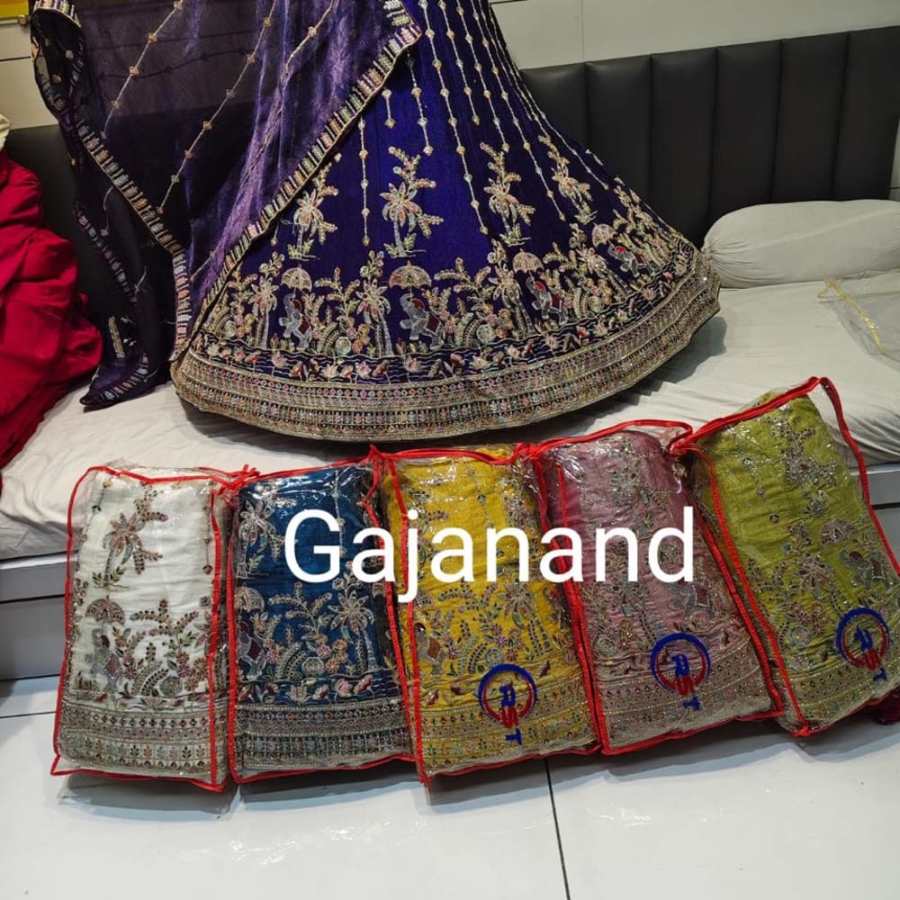 Various, including deep blue, yellow, red, white, and green with gold and multi-colored embroidery. Lehenga Choli