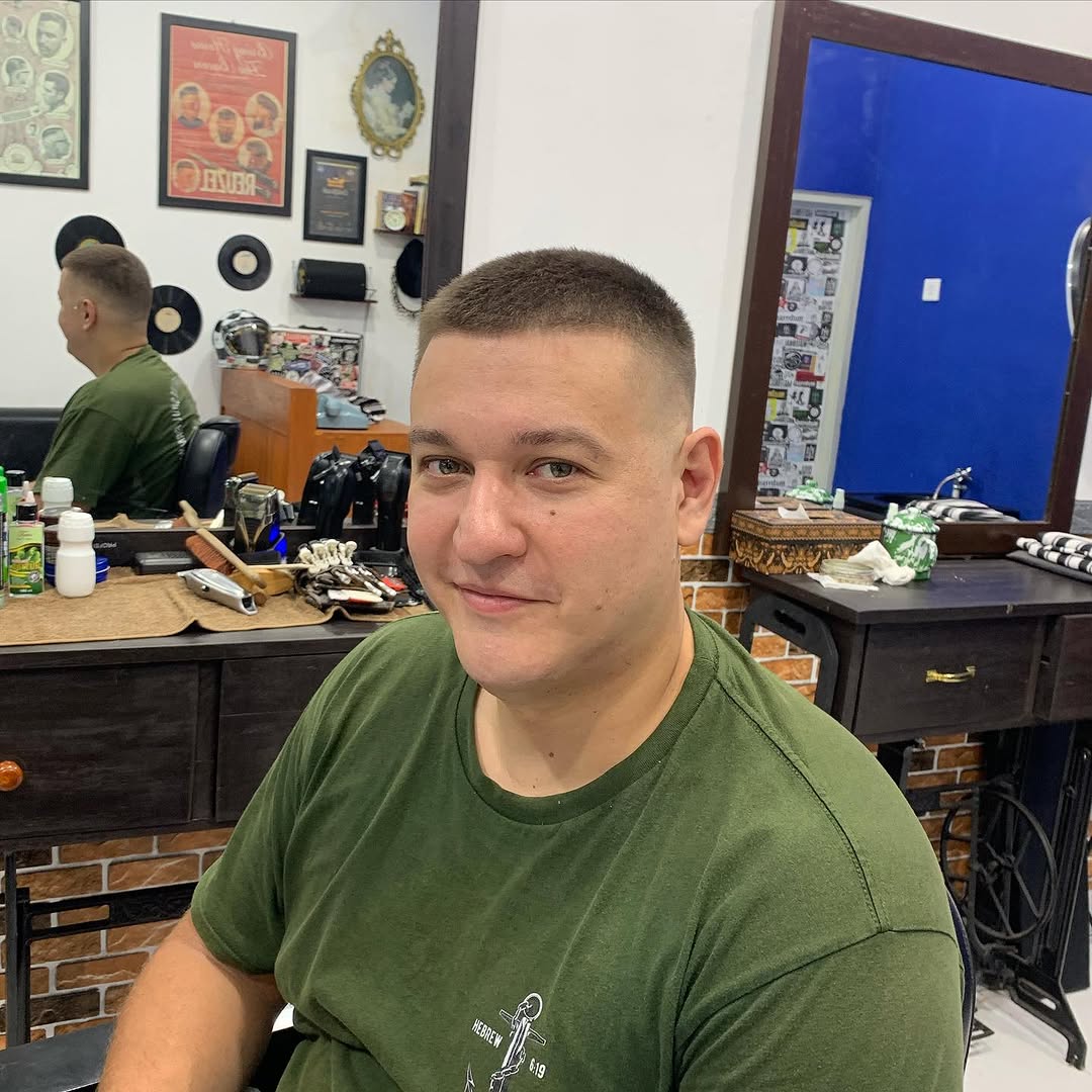 Smiling customer after fade Bali barbershop
