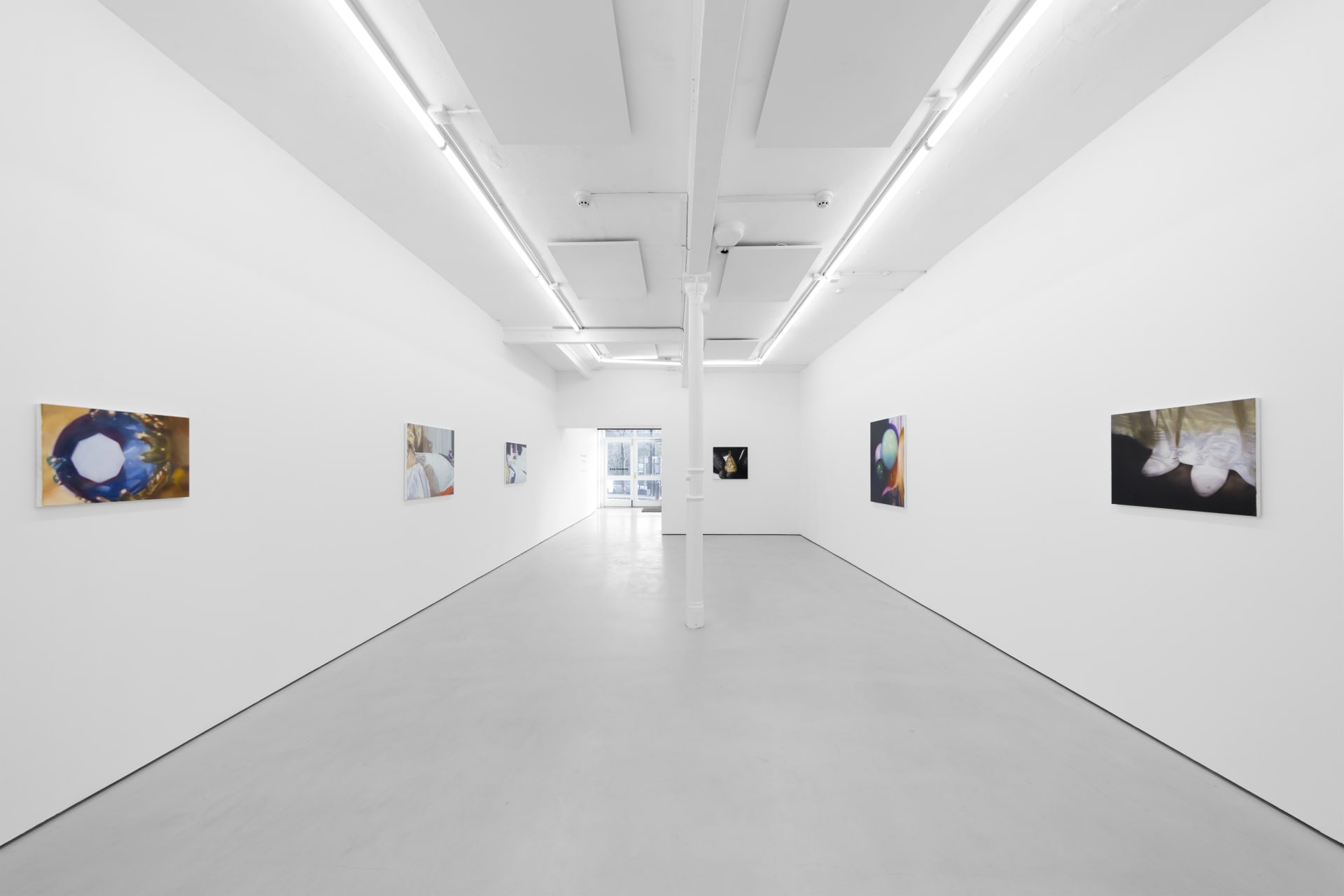 Rachel Lancaster's medium scale oil paintings of domestic objects from cinema are hung in a spacious white gallery space