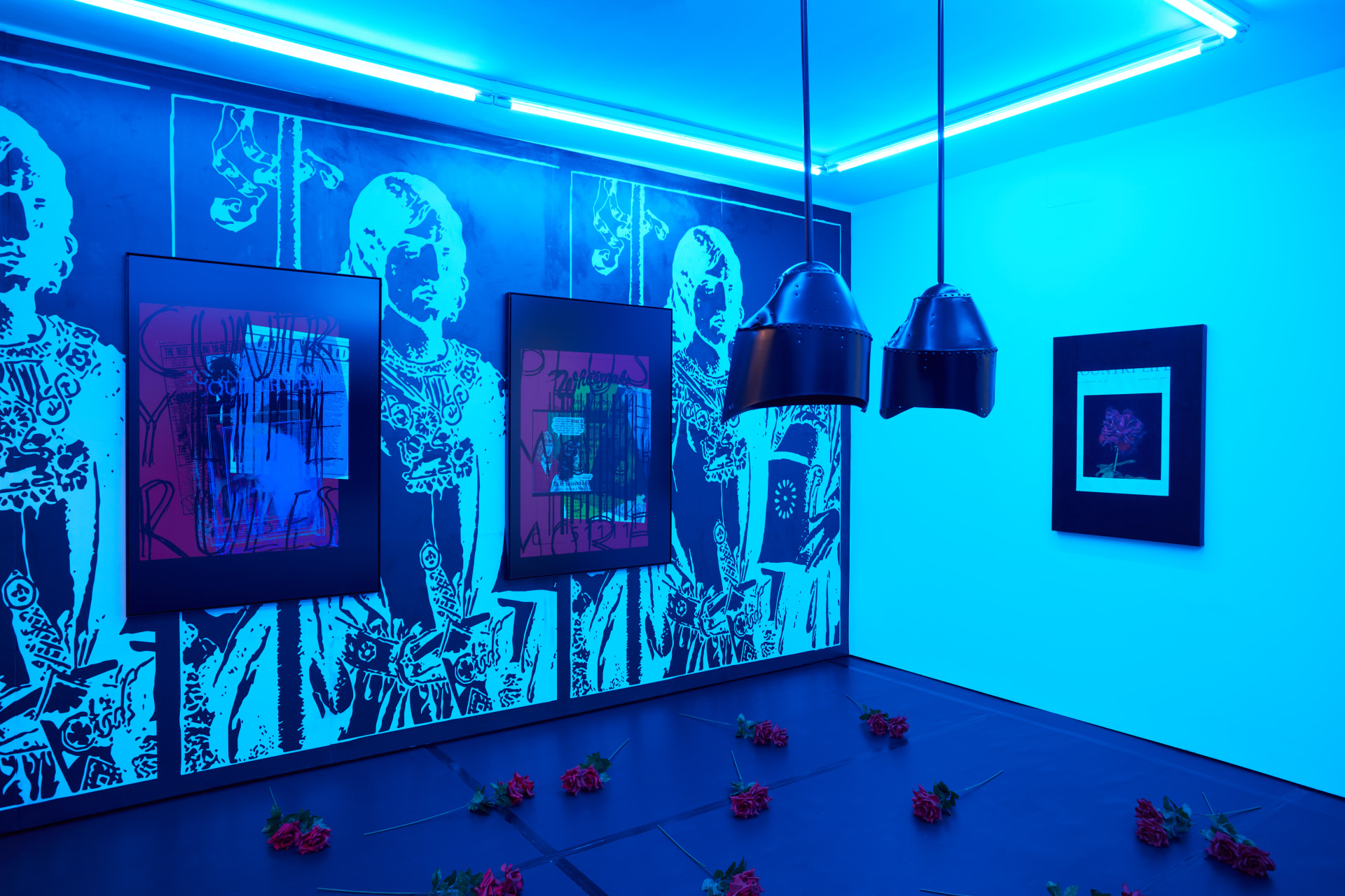 Installation images of Simeon Barclay's exhibition at Workplace in London, artworks, sculpture and video are cast in filtered blue light of a night club