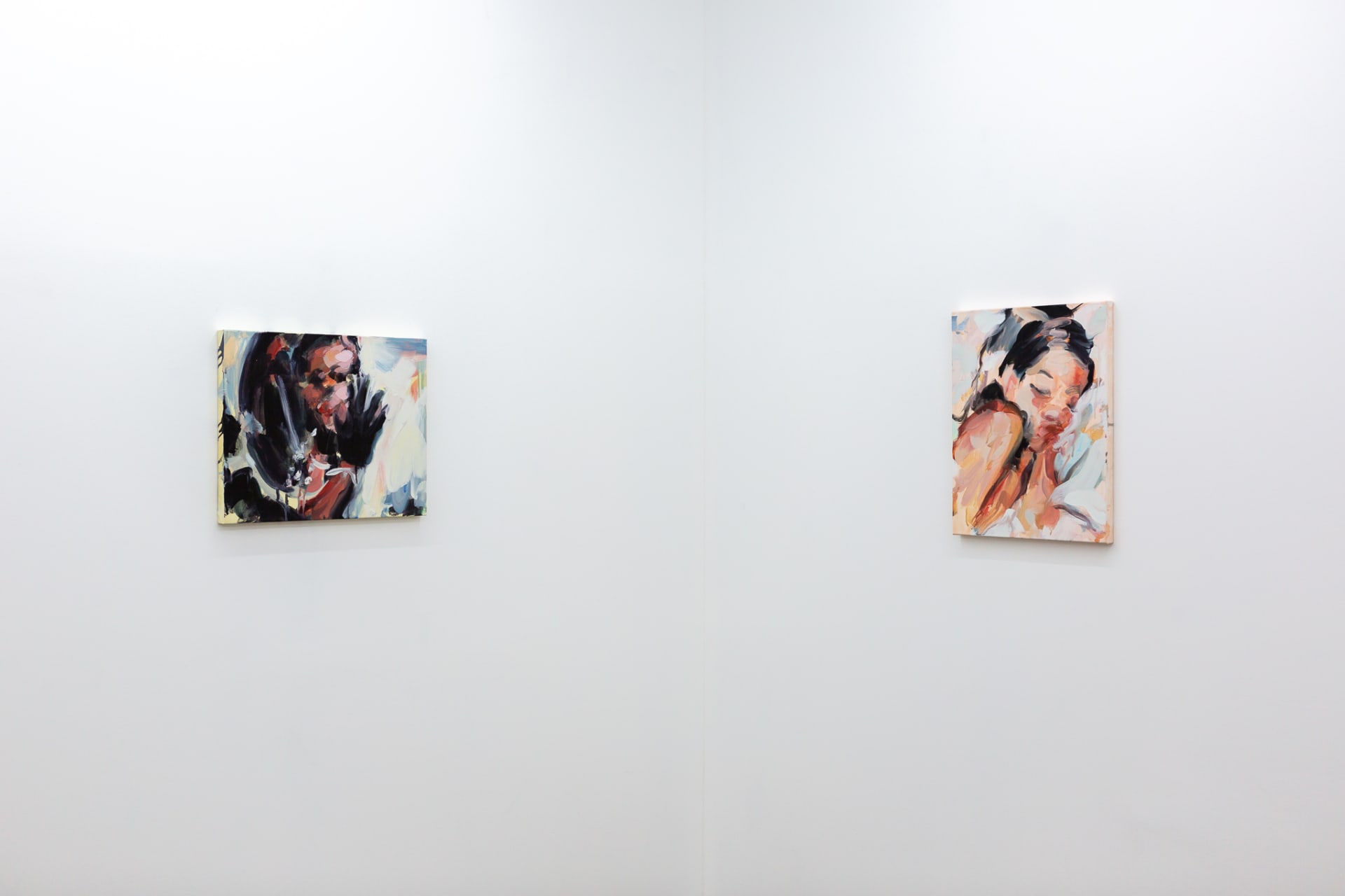 Installation shots of Laura Lancaster's solo show at Workplace London. Close up crop paintings of sleeping women and figures in landscapes, loosely painted.