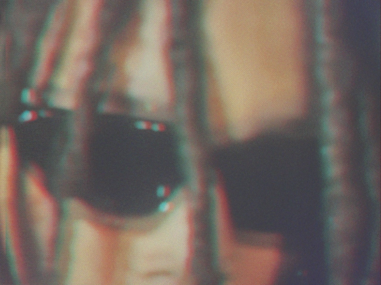 close up image of a model at a Celine fashion show, the model has dreadlocks and is wearing dark glasses
