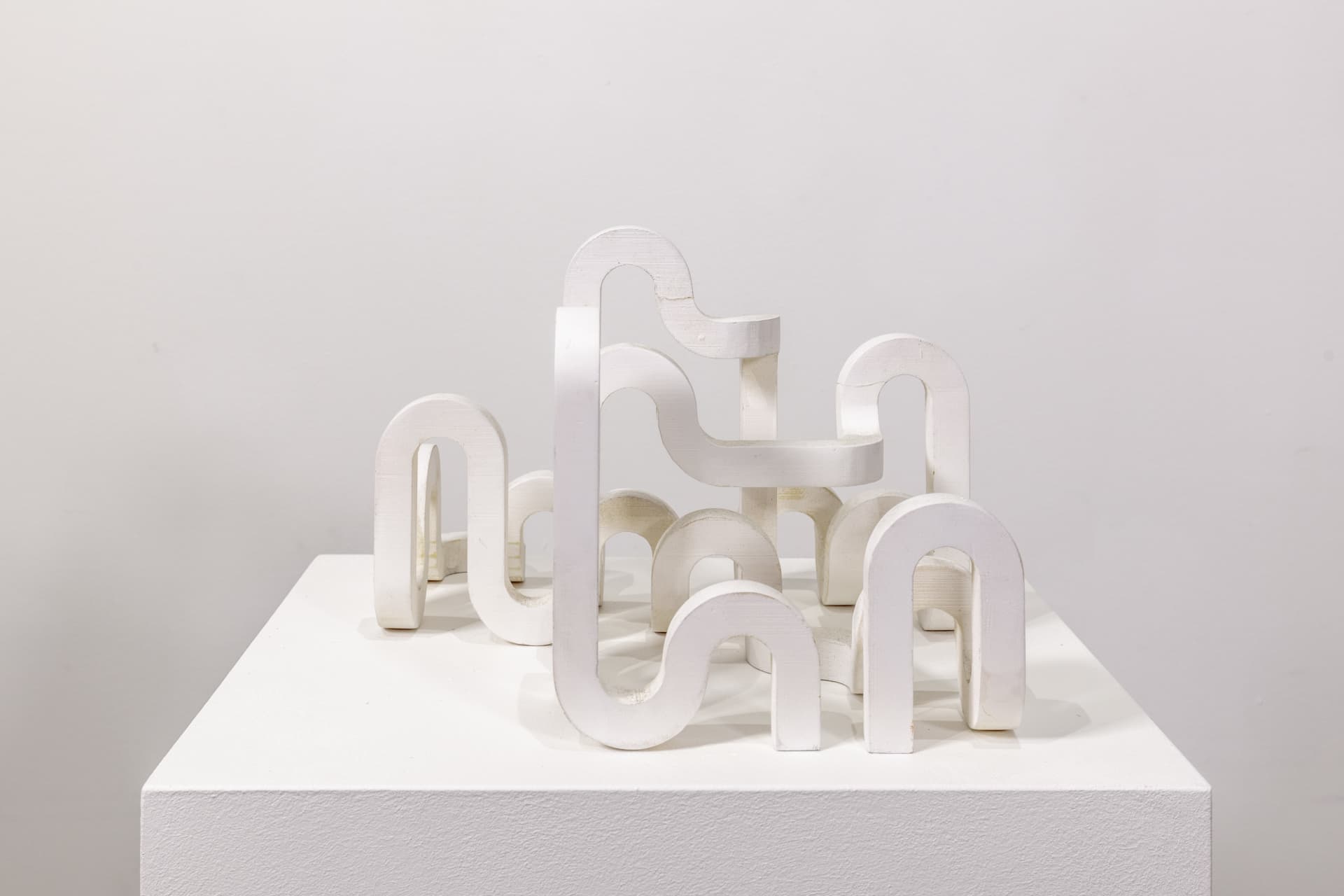 A sculpture by Jacob Dahlgren of a white looping structure made from PLA plastic