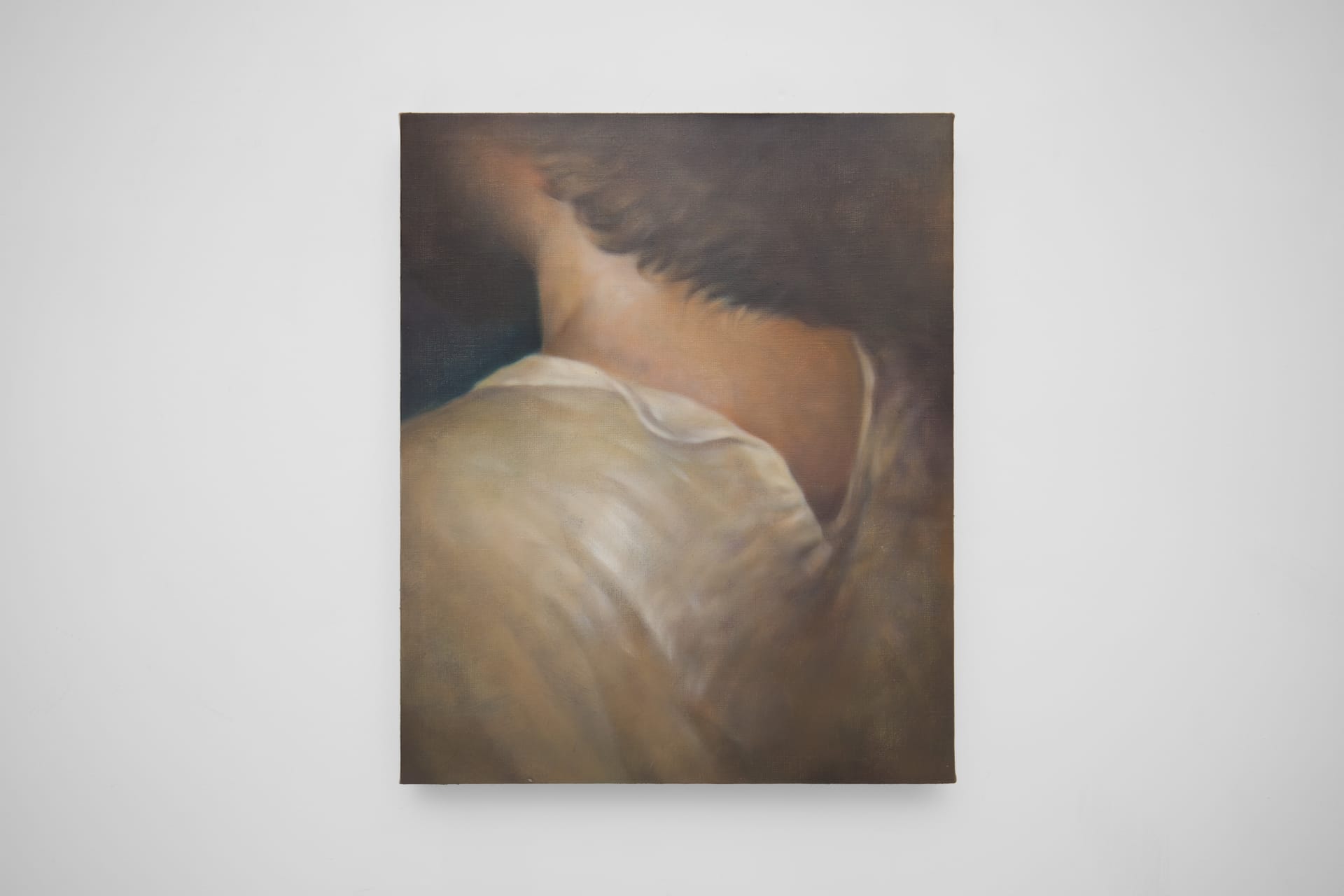 Short haired person from behind wearing cotton shirt