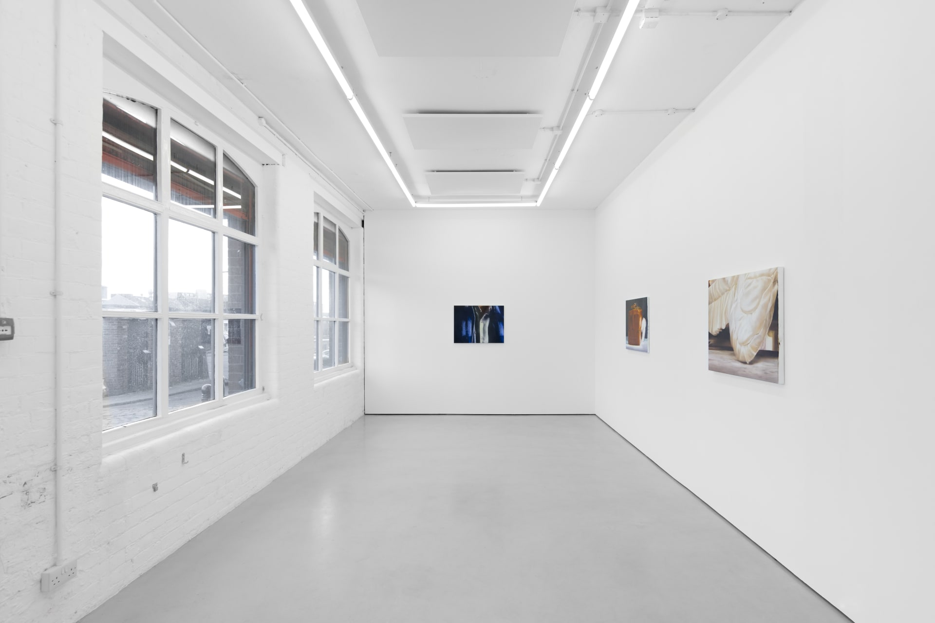 Rachel Lancaster's medium scale oil paintings of domestic objects from cinema are hung in a spacious white gallery space
