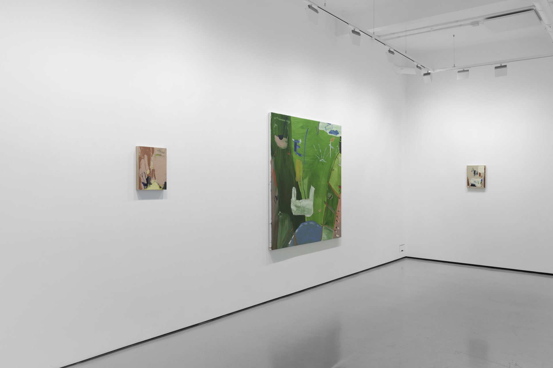 A white walled gallery with 4 artworks by b chehayeb hung on the walls