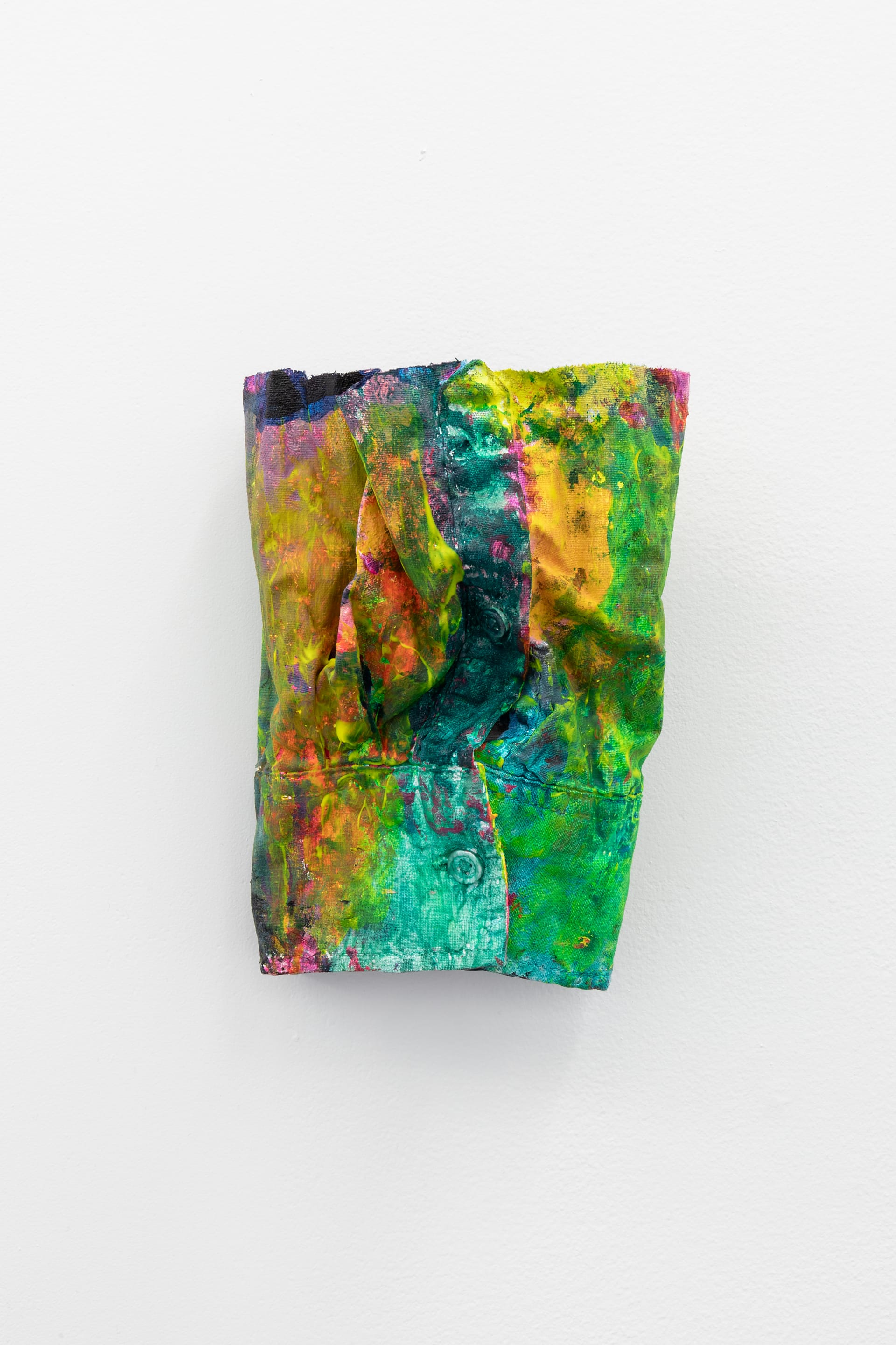 Artwork by Hayley Tompkins, cut off sleeve covered in brightly coloured paint