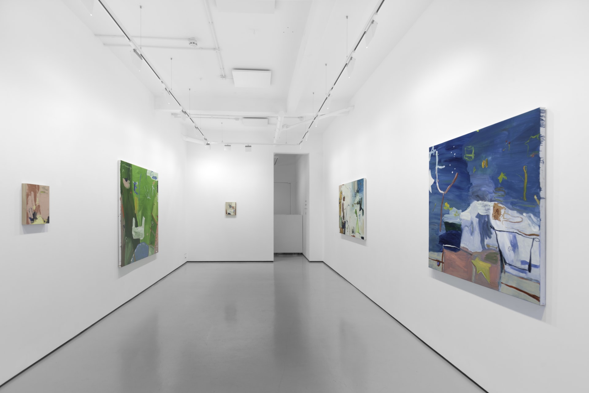 A white walled gallery with 4 artworks by b chehayeb hung on the walls