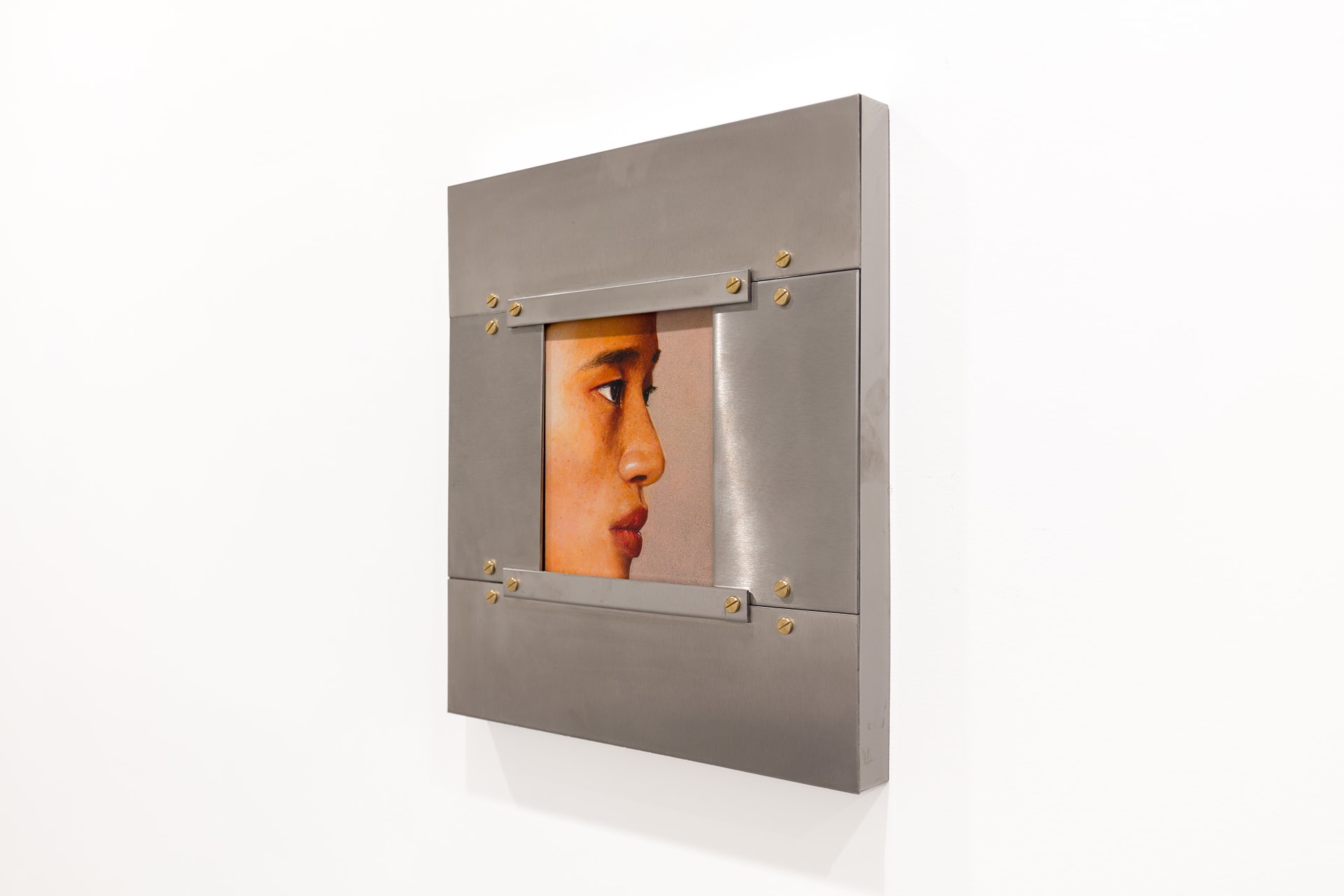 A painting by Ki Yoong of the side profile of a young man's face