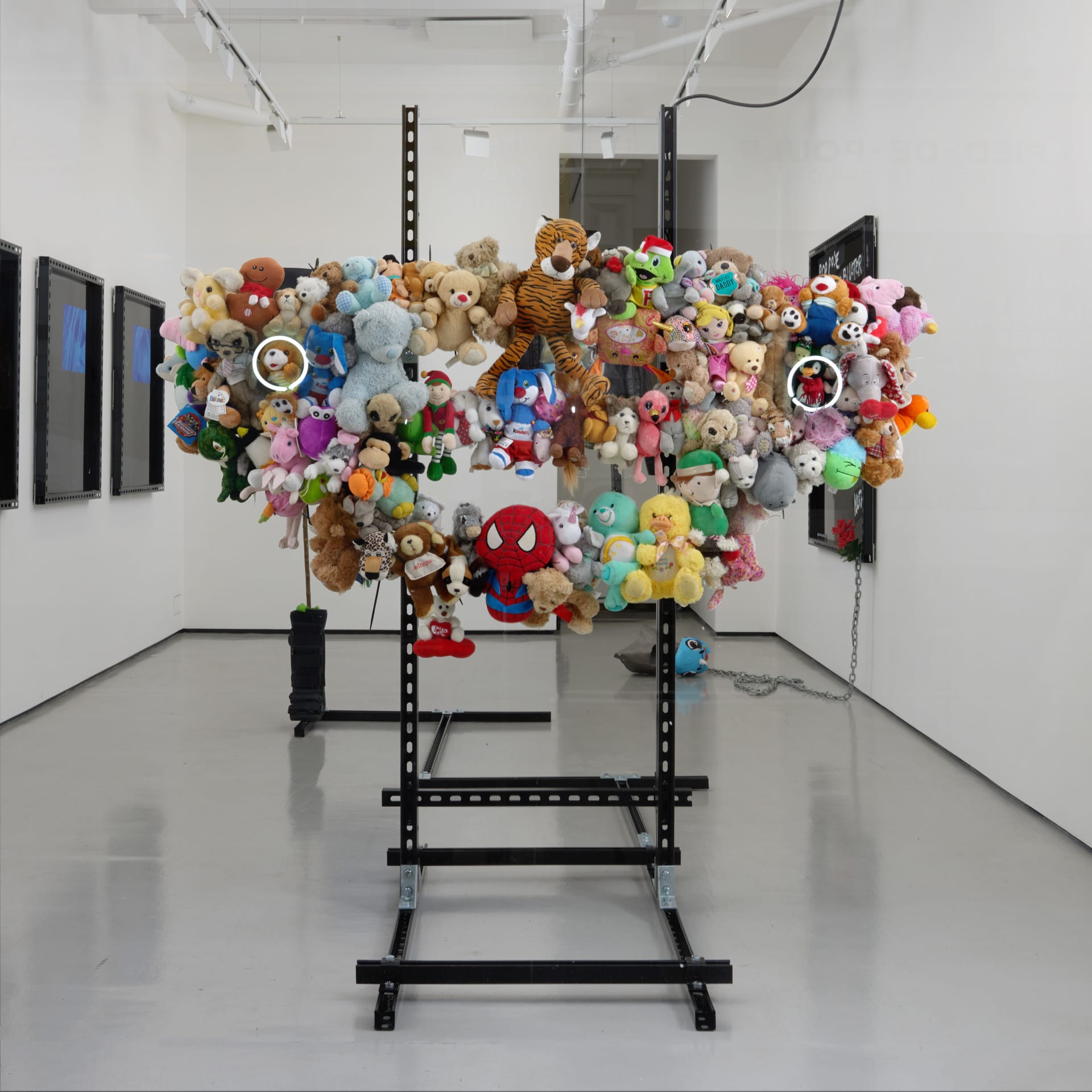 Photo of Buff #1, 2023 by Simeon Barclay consisting of Neon, metal, fixings, children’s stuffed toys, bull bar. 