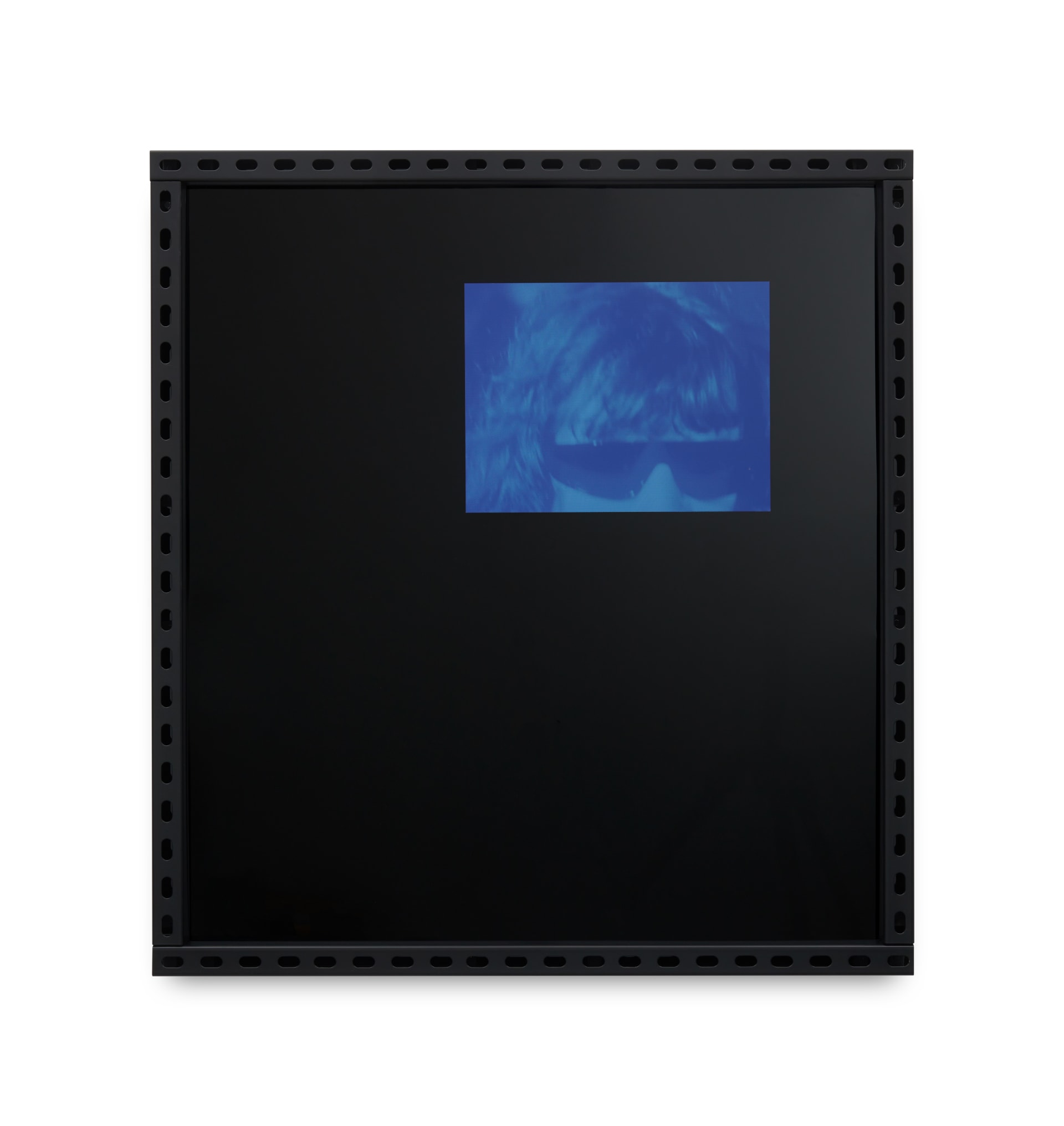 Black acrylic artwork featuring in the top right-hand corner a cropped, blue-toned photograph of a male face wearing sunglasses