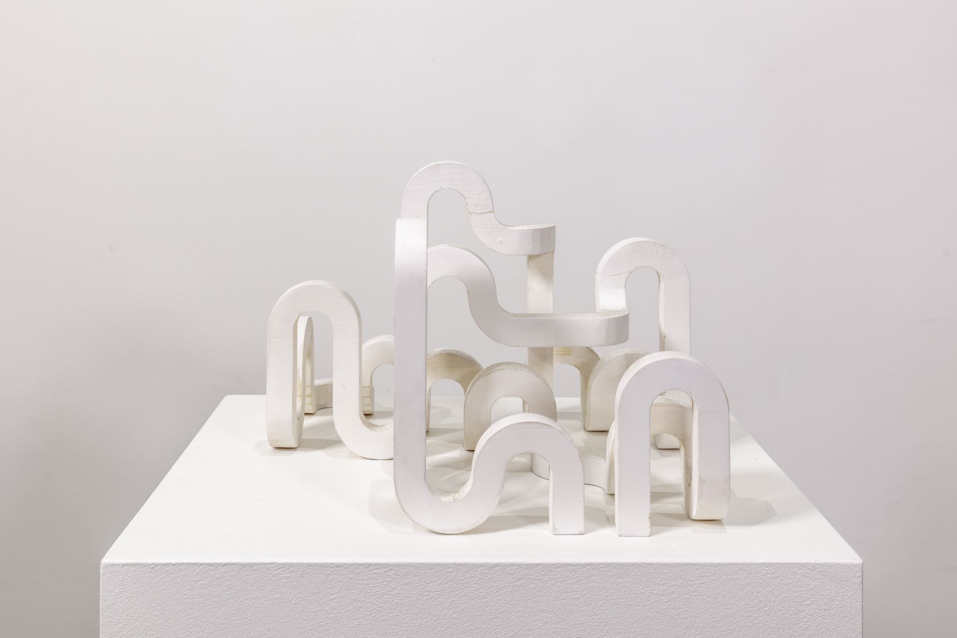 A sculpture by Jacob Dahlgren of a white looping structure made from PLA plastic