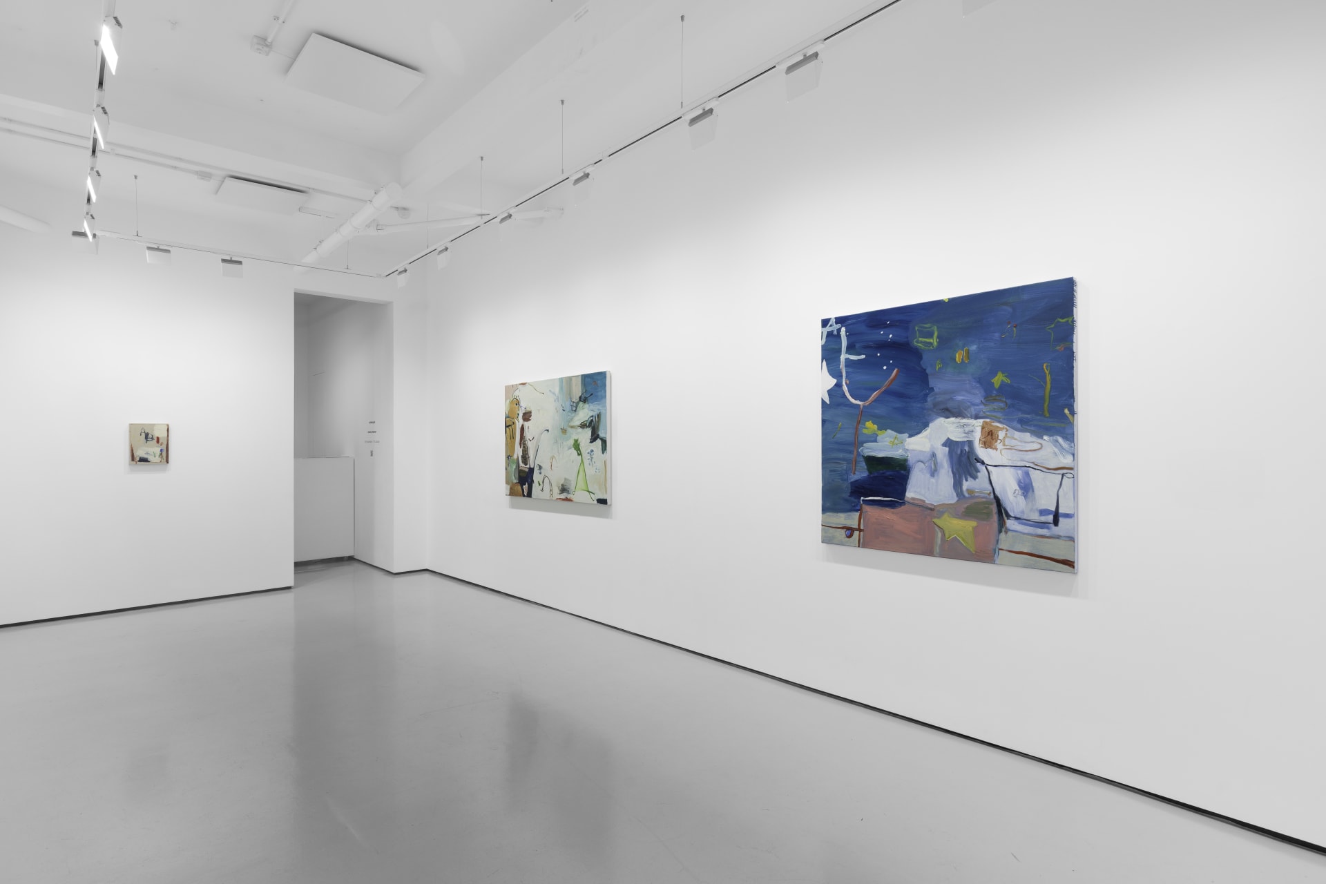 A white walled gallery with 4 artworks by b chehayeb hung on the walls