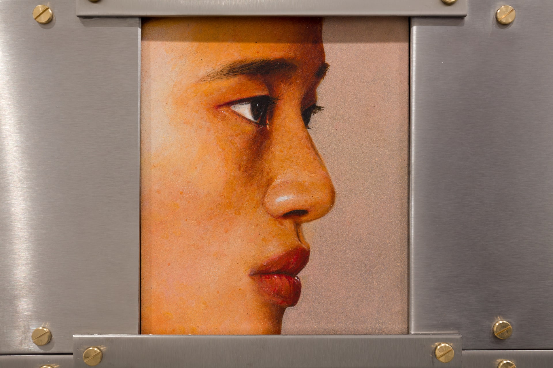 A painting by Ki Yoong of the side profile of a young man's face