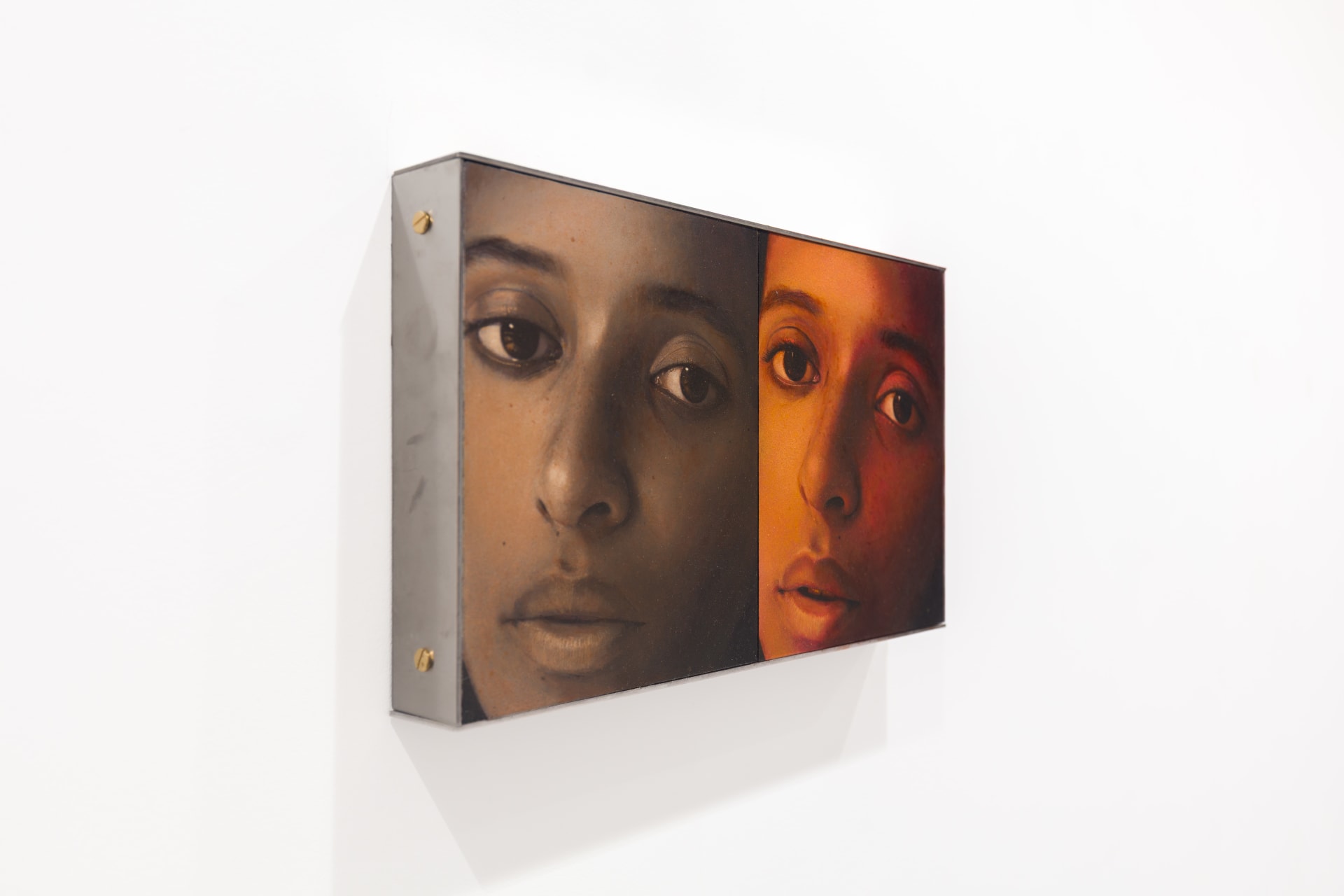 A diptych painting by Ki Yoong of two almost identical portraits of a young woman side by side