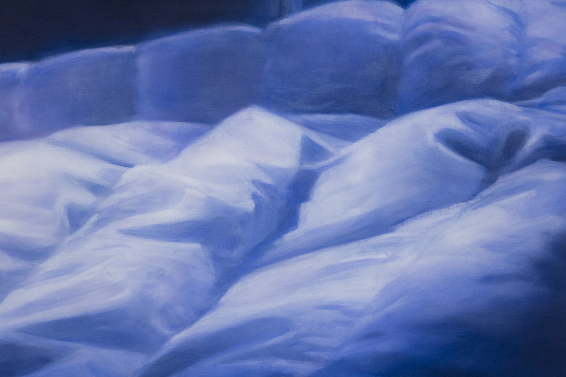 detail crop of Rachel Lancaster's painting 'Lost In Another's Dream' a painting of a duvet shot at night in blue tones
