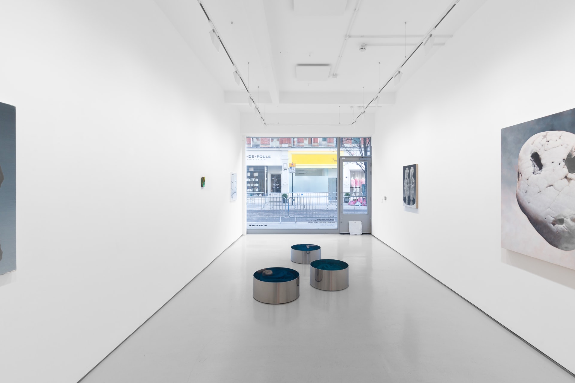 Installation view of the group exhibition Cold Feed at Workplace London including paintings and floor based sculpture