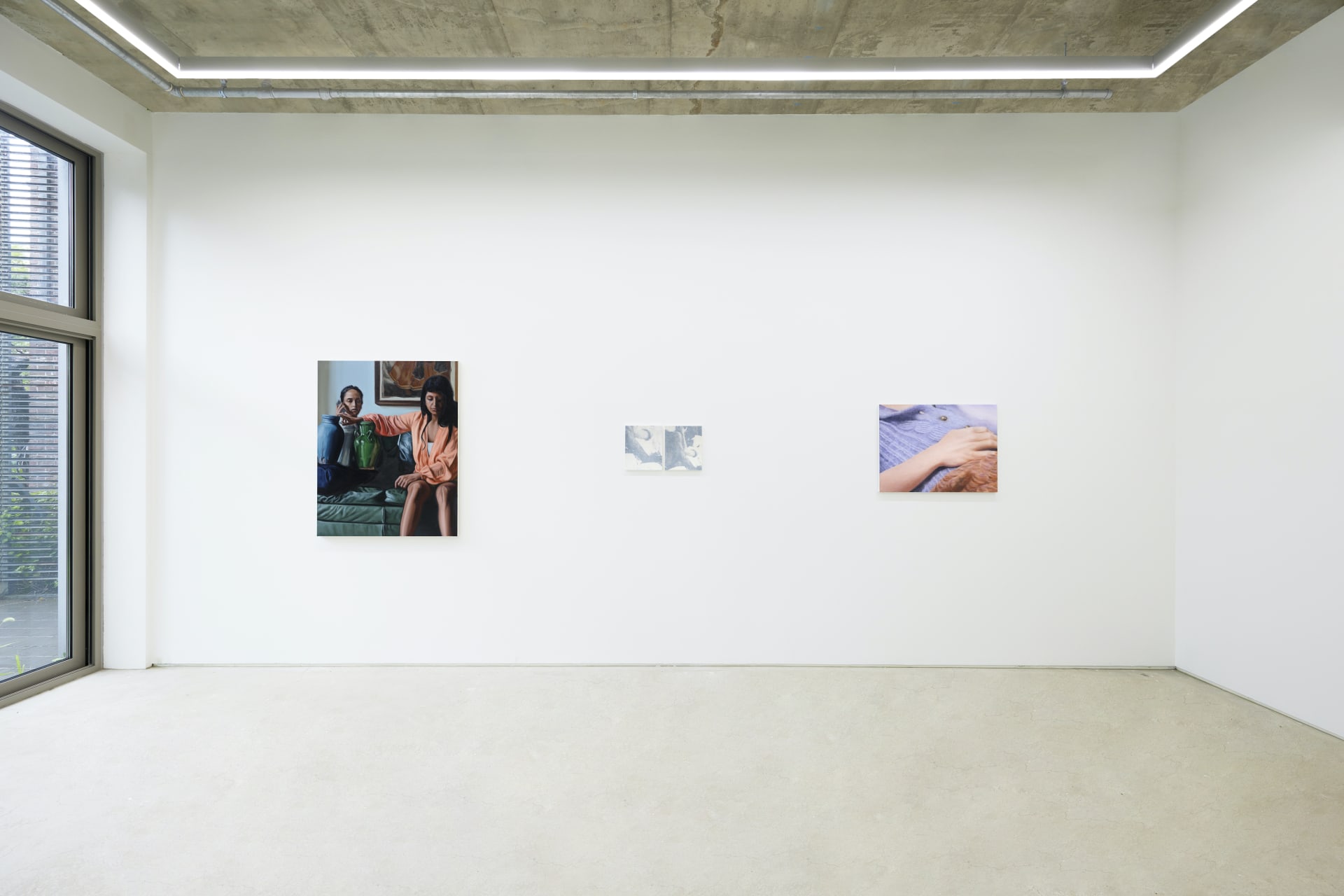 An installation view of a group painting exhibition including a painting by Rachel Lancaster